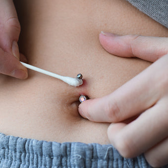 how to heal your belly button piercing faster