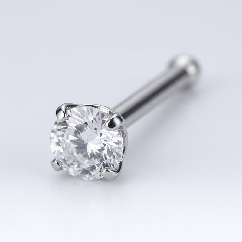 18G surgical steel nose bone stud with a 3mm clear CZ gem in a four-prong setting, close-up detail