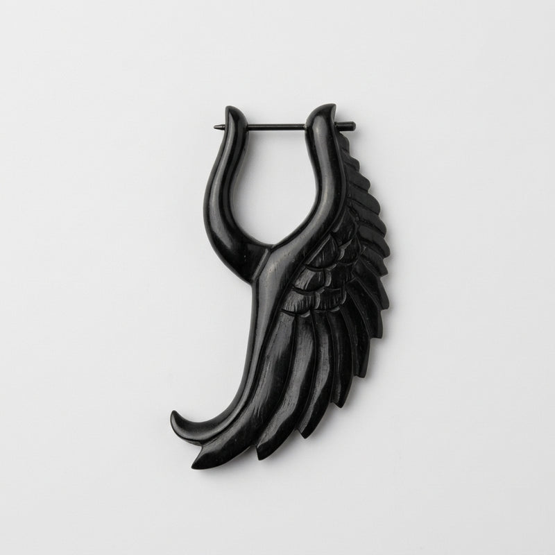 16G organic water buffalo horn earring with a carved black angelic wing design and straight metal pin closure.