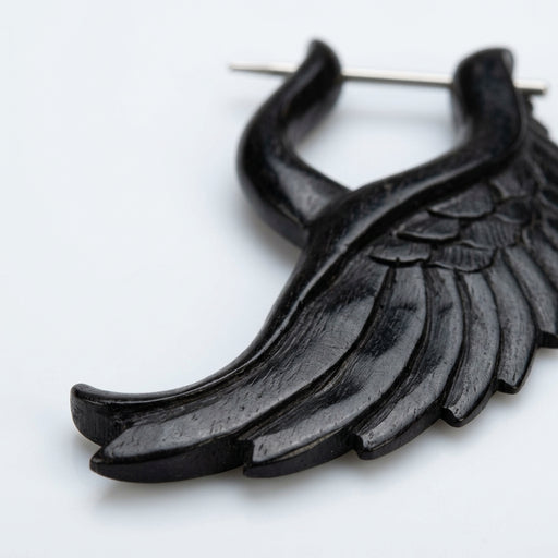 16G organic water buffalo horn earring in an angelic wing design with a metal pin, close-up view