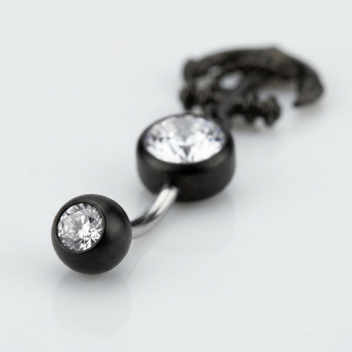 14G PVD coated steel curved navel ring with clear CZ gems and black anchor dangle, close-up