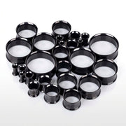 6G-1" PVD coated steel double flared eyelets with a black finish, multiple sizes in a three-quarter view