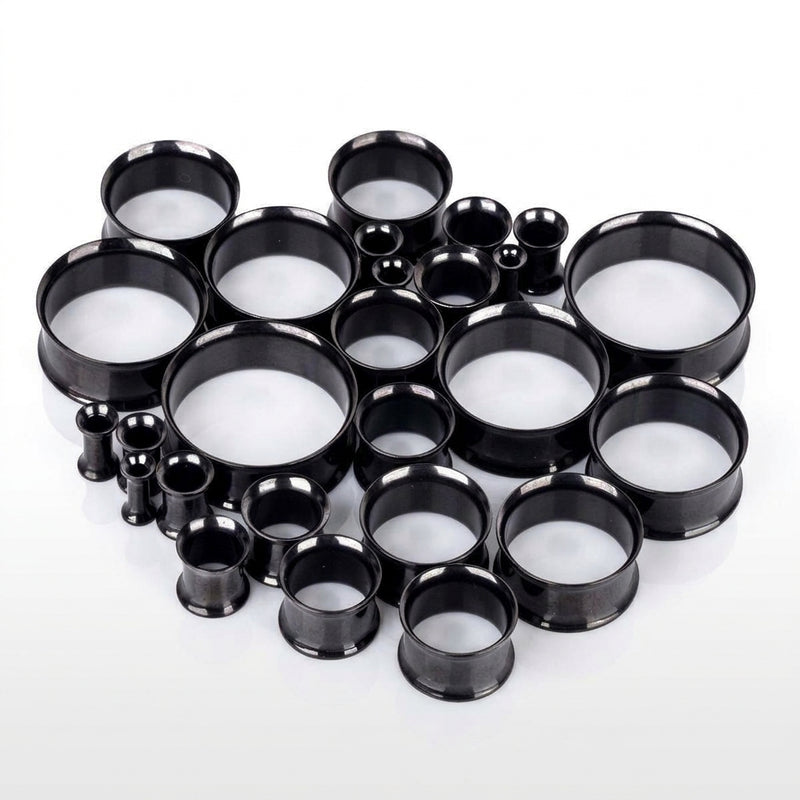 6G-1" PVD coated steel double flared eyelets with a black finish, multiple sizes in a three-quarter view