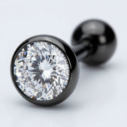 14G PVD coated steel tongue barbell with clear bezel-set CZ gem and black ball end, close-up
