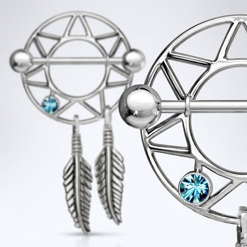 14G surgical steel dream catcher nipple shields with blue CZ gems, dangling feathers, and ball ends, close-up
