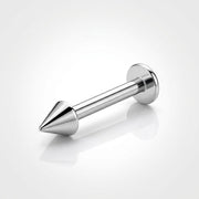 16G titanium labret stud with a spike end and flat back, three-quarter view on a reflective white surface