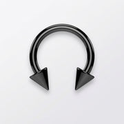 14G black PVD coated steel circular barbell with spike ends, flat-lay view on a white background.