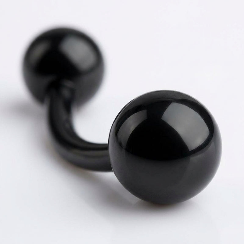 14G PVD coated steel black curved barbell with glossy ball ends, close-up detail view