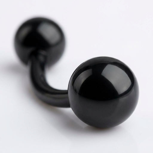 14G PVD coated steel black curved barbell with glossy ball ends, close-up detail view