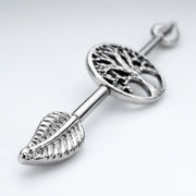14G surgical steel industrial barbell with Tree of Life design and detailed leaf ends, close-up view