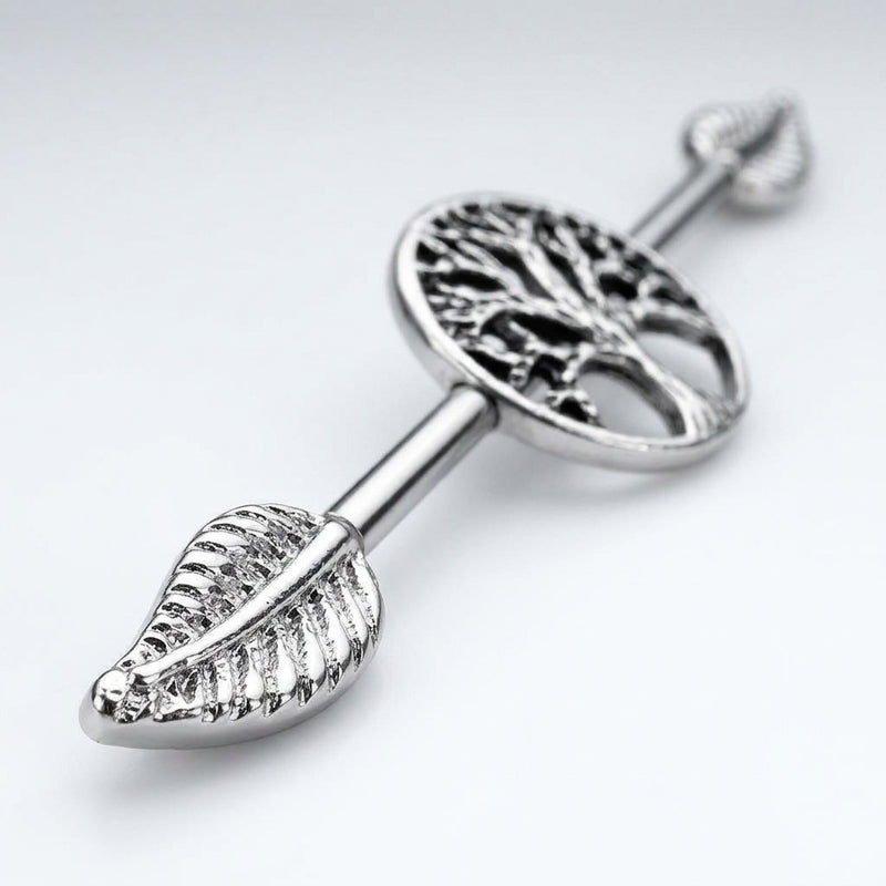 14G surgical steel industrial barbell with Tree of Life design and detailed leaf ends, close-up view