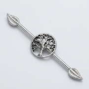 14G surgical steel industrial barbell with a central tree of life design and leaf ends, three-quarter view.