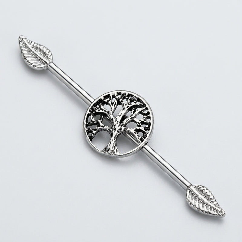 14G surgical steel industrial barbell with a central tree of life design and leaf ends, three-quarter view.