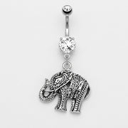 14G surgical steel curved navel ring with double clear CZ gems and an antique-style elephant dangle, flat lay.