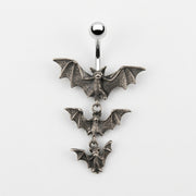 14G surgical steel navel ring with a polished top ball and three dangling antique silver bats of decreasing sizes.