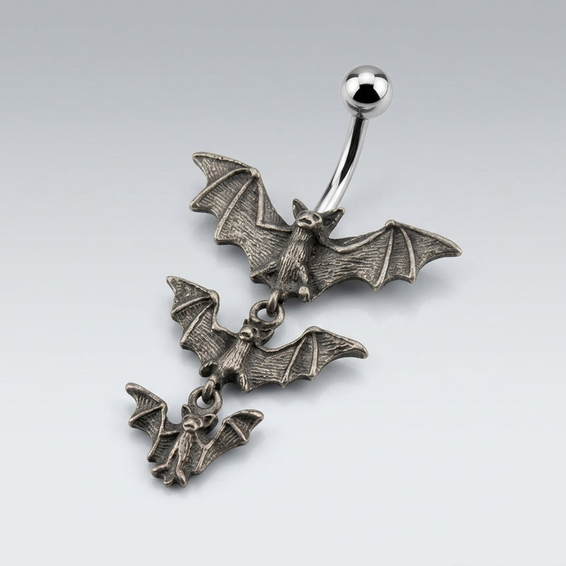 14G surgical steel navel ring with curved barbell, polished ball, and three cascading antique silver gothic bats.