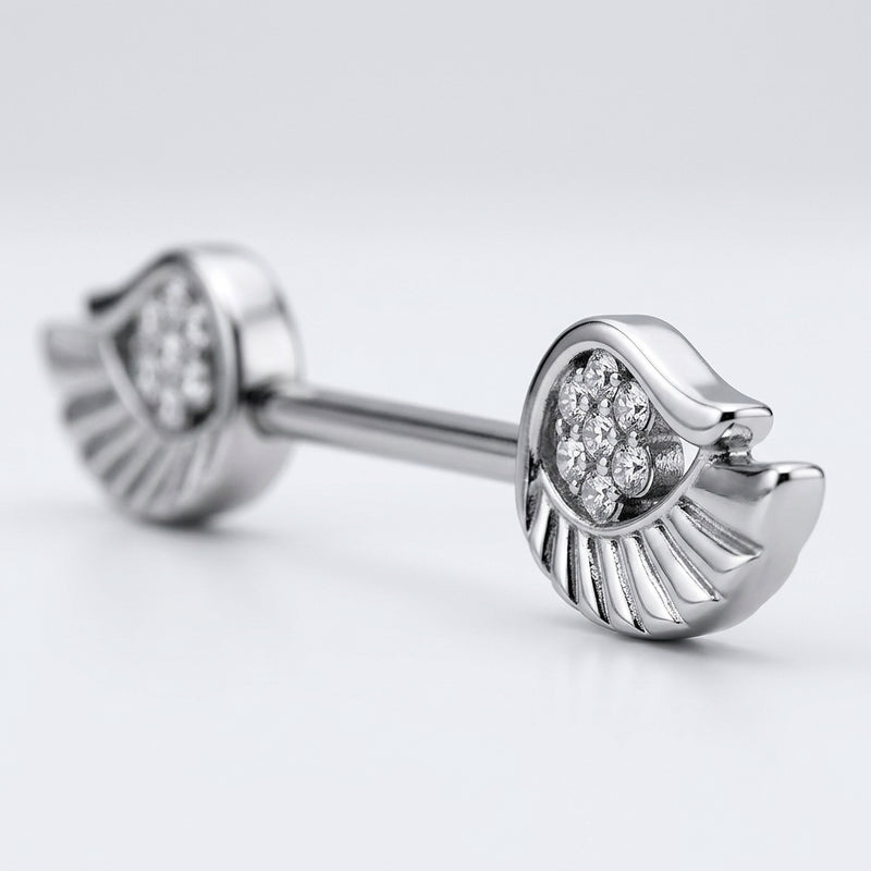 14G surgical steel nipple barbell with angel wings set with clear CZ gems, close-up detail
