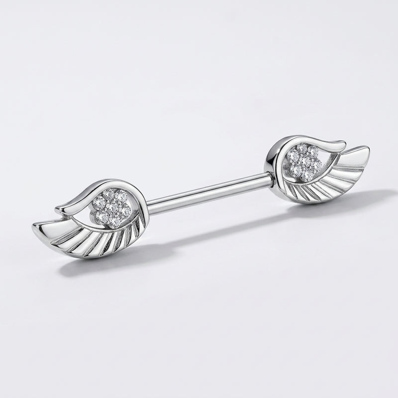 14G surgical steel nipple barbell with angel wing ends set with clear CZ gems, three-quarter view on white