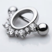 14G surgical steel nipple shield with a half circle of clear CZ gems and a straight barbell with ball ends, close-up
