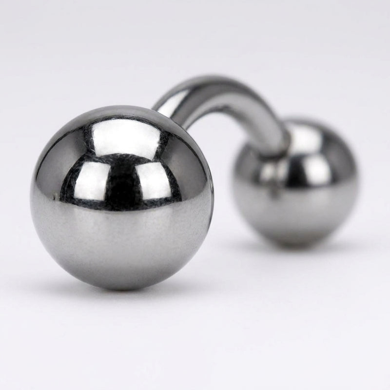 16G titanium curved eyebrow barbell with plain polished ball ends, close-up detail on a white background