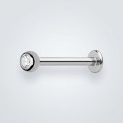 18G titanium labret stud with a 3mm clear CZ bezel-set gem and flat disk backing, side view