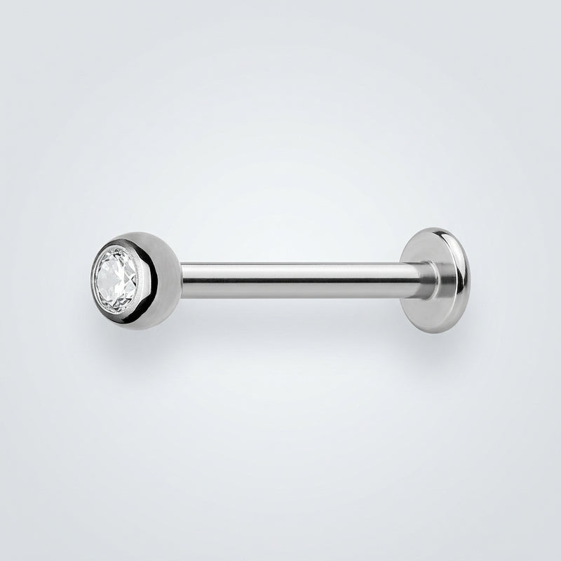 18G titanium labret stud with a 3mm clear CZ bezel-set gem and flat disk backing, side view