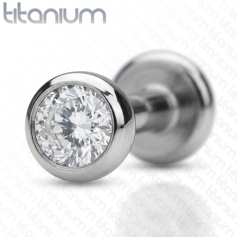 18G titanium labret stud with a 3mm bezel-set clear CZ gem, close-up detail on a white background