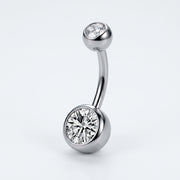 14G titanium navel ring with double clear bezel-set CZ gems, curved barbell in a three-quarter view.