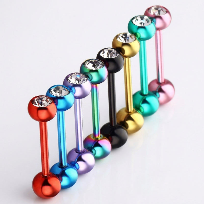 14G PVD coated steel tongue rings with colorful ball ends and clear CZ gems, diagonal row, three-quarter view