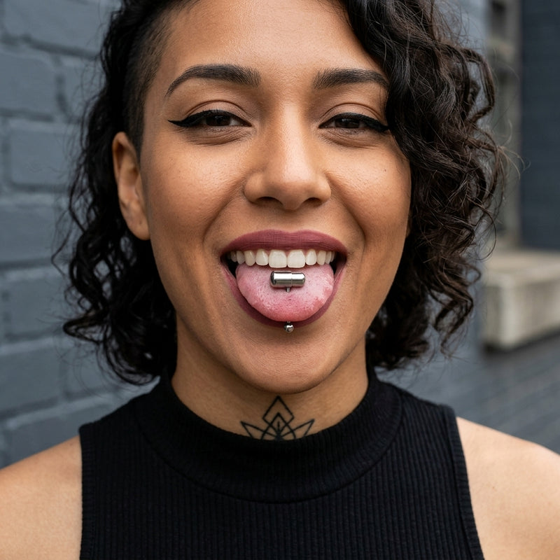 14G surgical steel tongue ring with a silver capsule vibrating design, worn in a tongue piercing.