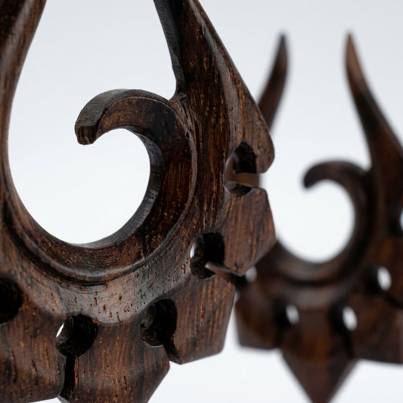 16G sono wood tribal ornament earrings with hand-carved spiral design, close-up detail shot on a white background.