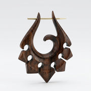 16G Sono wood tribal ornament earring with hand-carved spiral design and brass pin, three-quarter view
