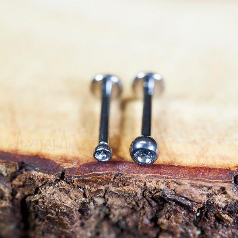 16G titanium labret stud with 2mm and 3mm cubic zirconia gems for comfortable lip piercing. Internally threaded design for easy wear.