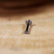 16G titanium labret stud with 2mm and 3mm cubic zirconia gems for lip piercing, featuring internally threaded design for comfort.