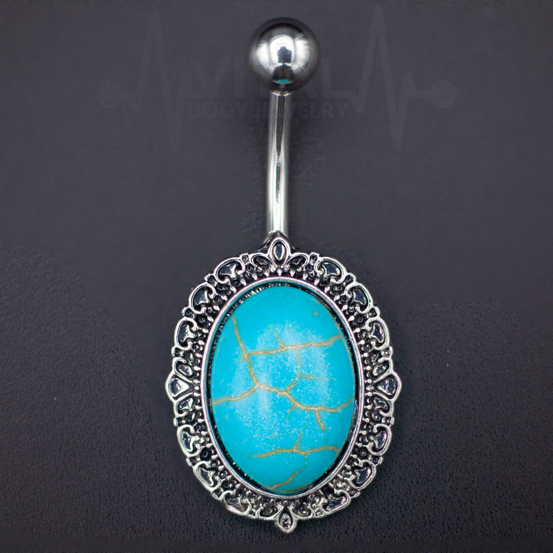 14G surgical steel belly ring with a large turquoise stone, featuring an externally threaded design and durable construction for sensitive skin.
