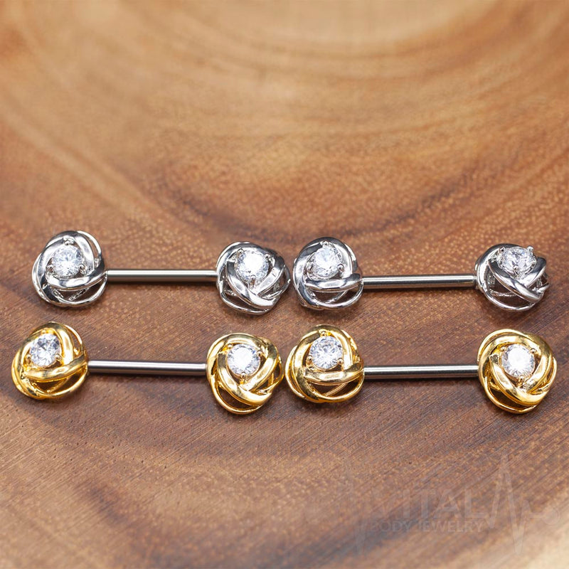 14G surgical steel nipple barbell with rose blossom design and centered cubic zirconia gem for a romantic touch.