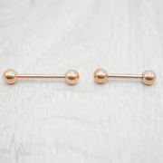 14G PVD coated surgical steel nipple barbell with a smooth black finish, featuring 5mm ball ends and externally threaded design for secure wear