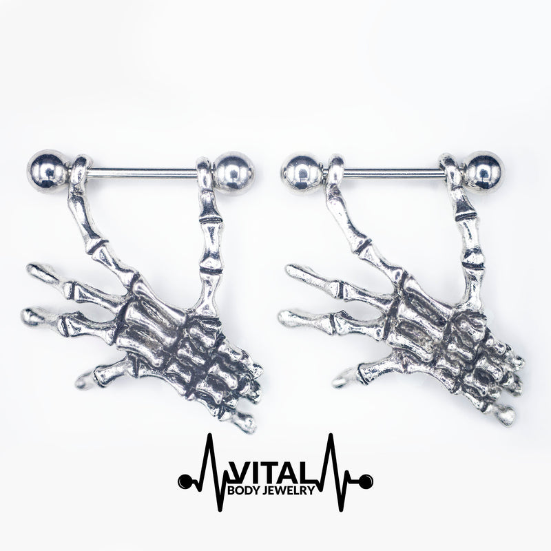 14G surgical steel nipple rings with lightweight skeleton hands dangle design for a unique, macabre style and comfortable wear.