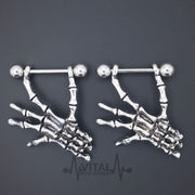 14G surgical steel nipple rings with dangle skeleton hands design for a striking gothic style and comfortable wear.