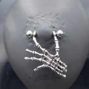 14G surgical steel nipple rings with dangling skeleton hands design for a unique and gothic style, perfect for expressing individuality.