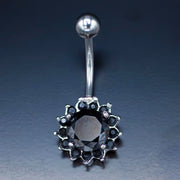 14G surgical steel belly ring with cubic zirconia flower design for a glamorous and comfortable fit.