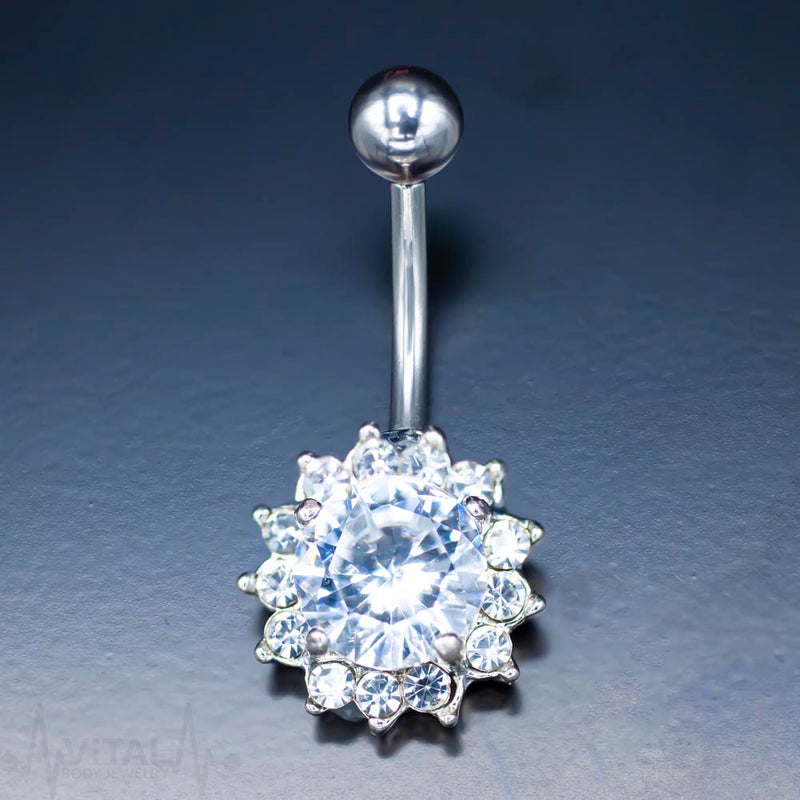 14G surgical steel belly ring with cubic zirconia flower design for navel piercing, featuring externally threaded ball end.