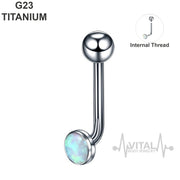 14G titanium vertical hood barbell with white opal gem, internally threaded for comfort and safety. Perfect for sensitive skin.