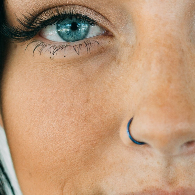 16G titanium seamless hinged septum ring with a sleek design for comfortable everyday wear, available in 5/16" and 3/8" diameters.