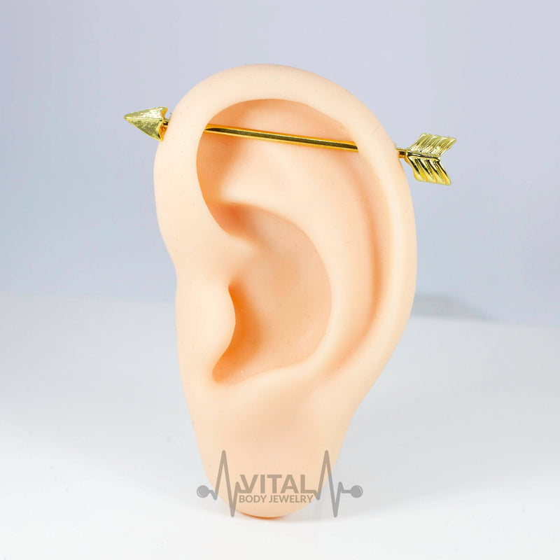 14G PVD coated surgical steel industrial barbell with arrow design, suitable for versatile piercings and comfort wear.
