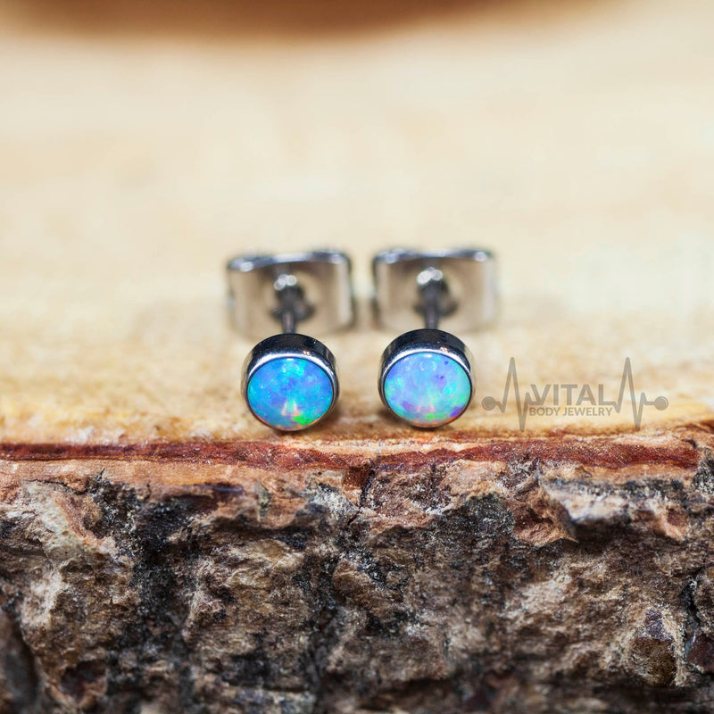 20G titanium opal stud earrings with 4mm white, aqua, and purple stones, designed for comfort and everyday wear.