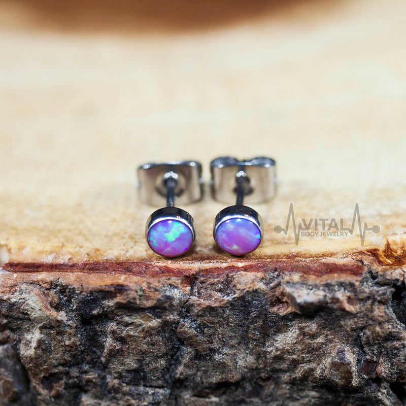 20G titanium stud earrings with 4mm opal stones in white, aqua, and purple colors for everyday wear.
