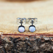 20G titanium stud earrings with 4mm opal gems in white, aqua, and purple, designed for sensitive ears and everyday comfort