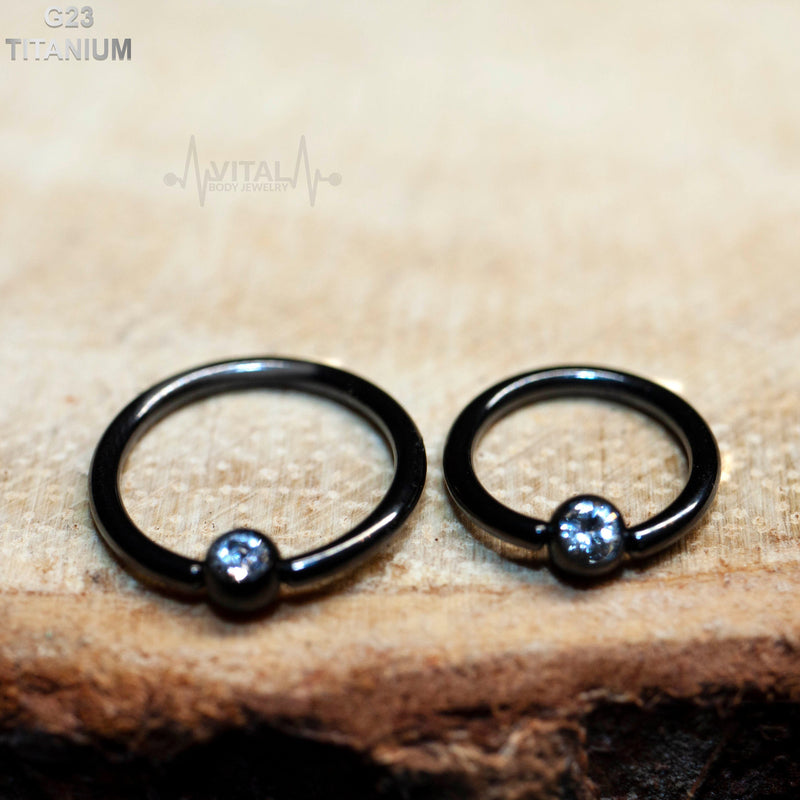 16G titanium nose ring with 3mm gem ball end, featuring a captive design and PVD coating for durability.