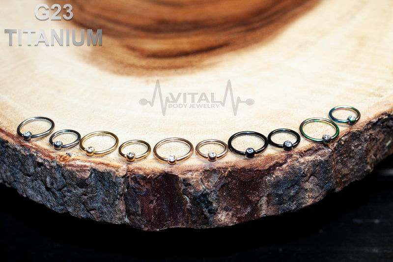 16G titanium nose ring with 3mm gem ball, designed for comfort and style, featuring PVD coating for durability.